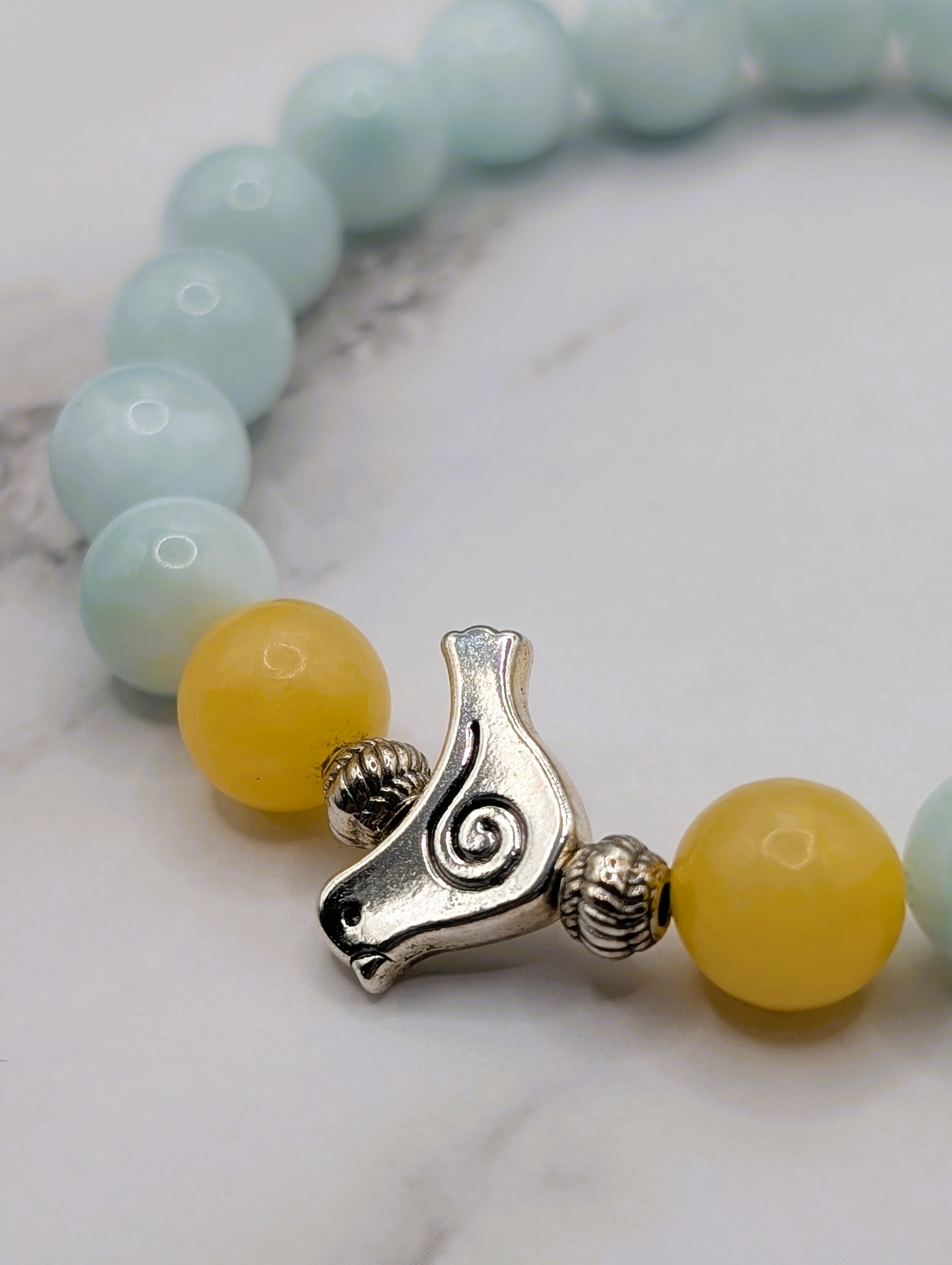 Angelite honey stone bird charm bracelet detail, natural gemstone jewelry