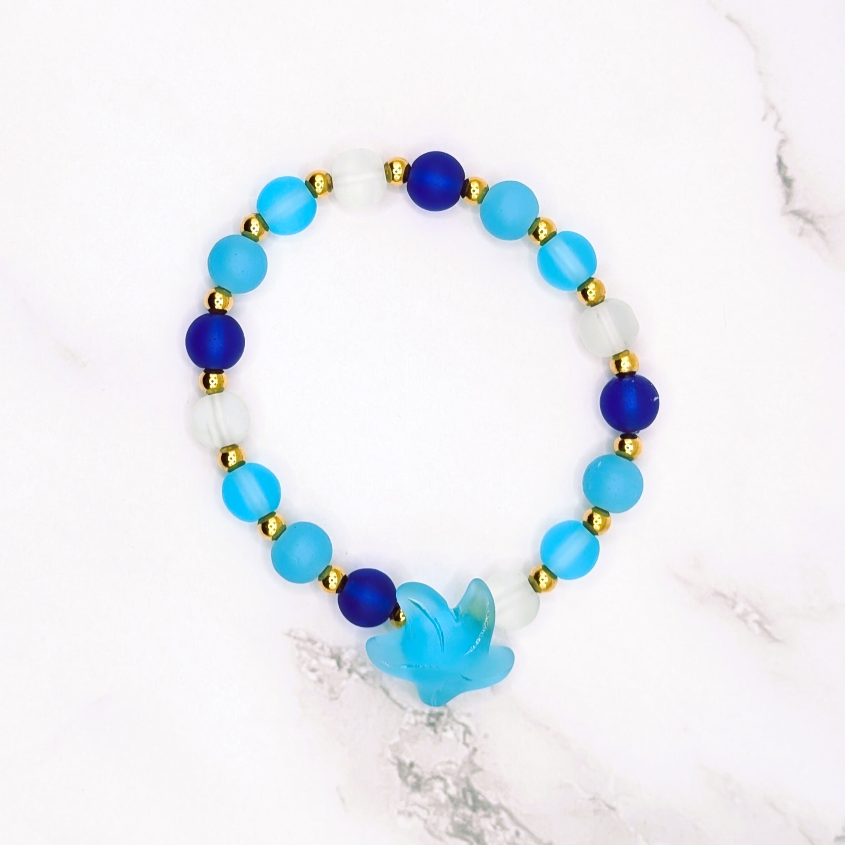 Handmade beach glass stretch bracelet with starfish charm and gold accents