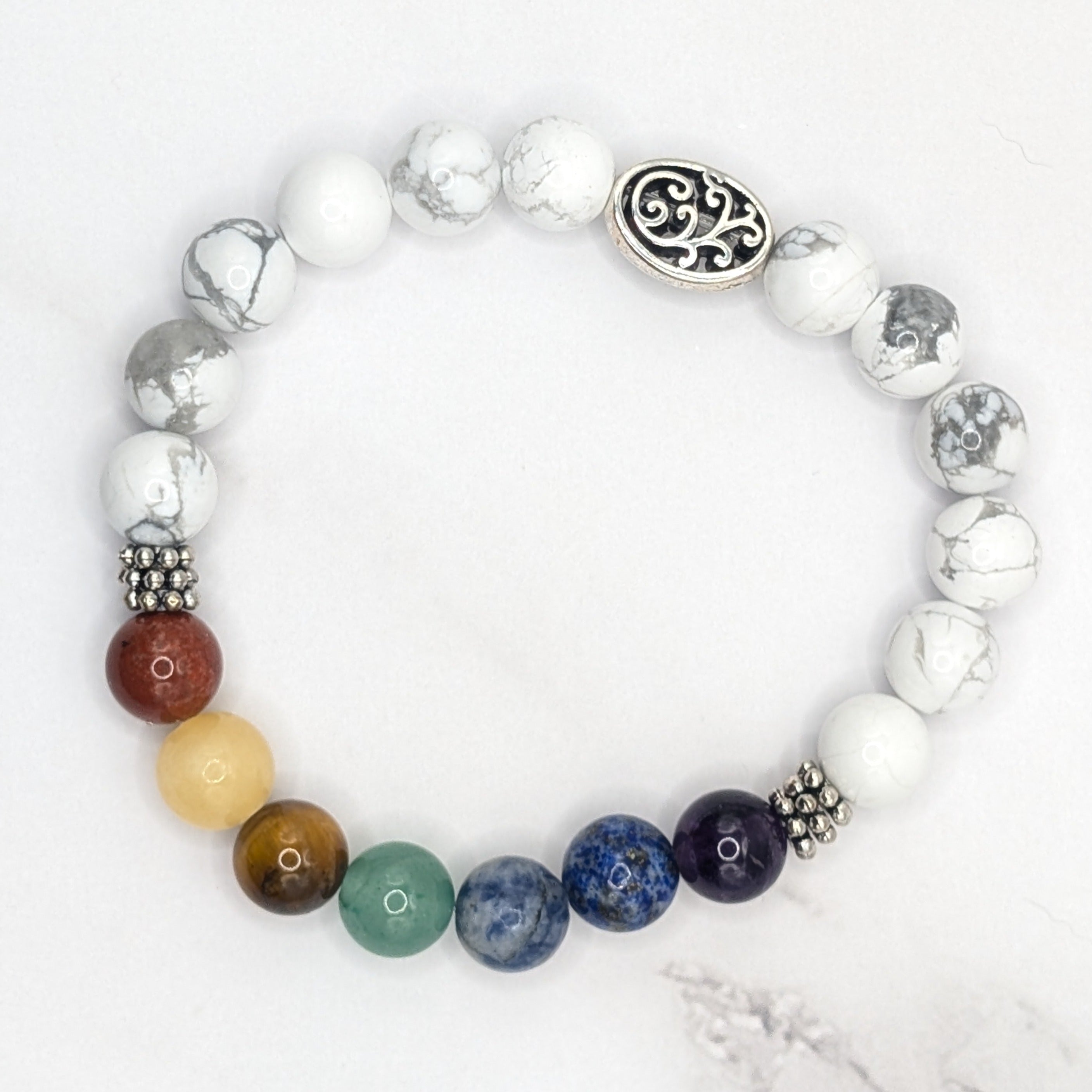 Handmade chakra stretch bracelet with white howlite and silver accent beads