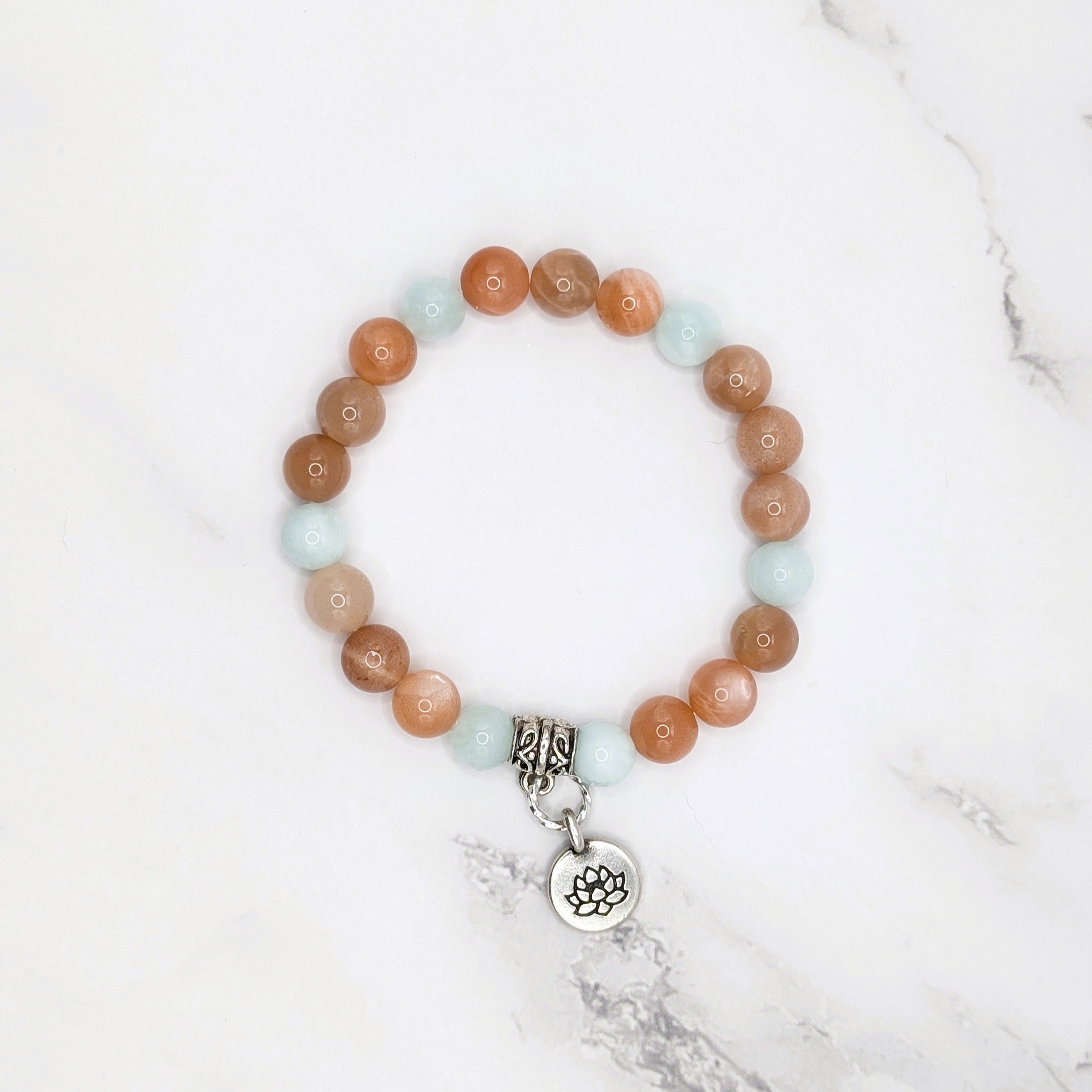 Handmade peach moonstone and green angelite stretch bracelet with lotus charm