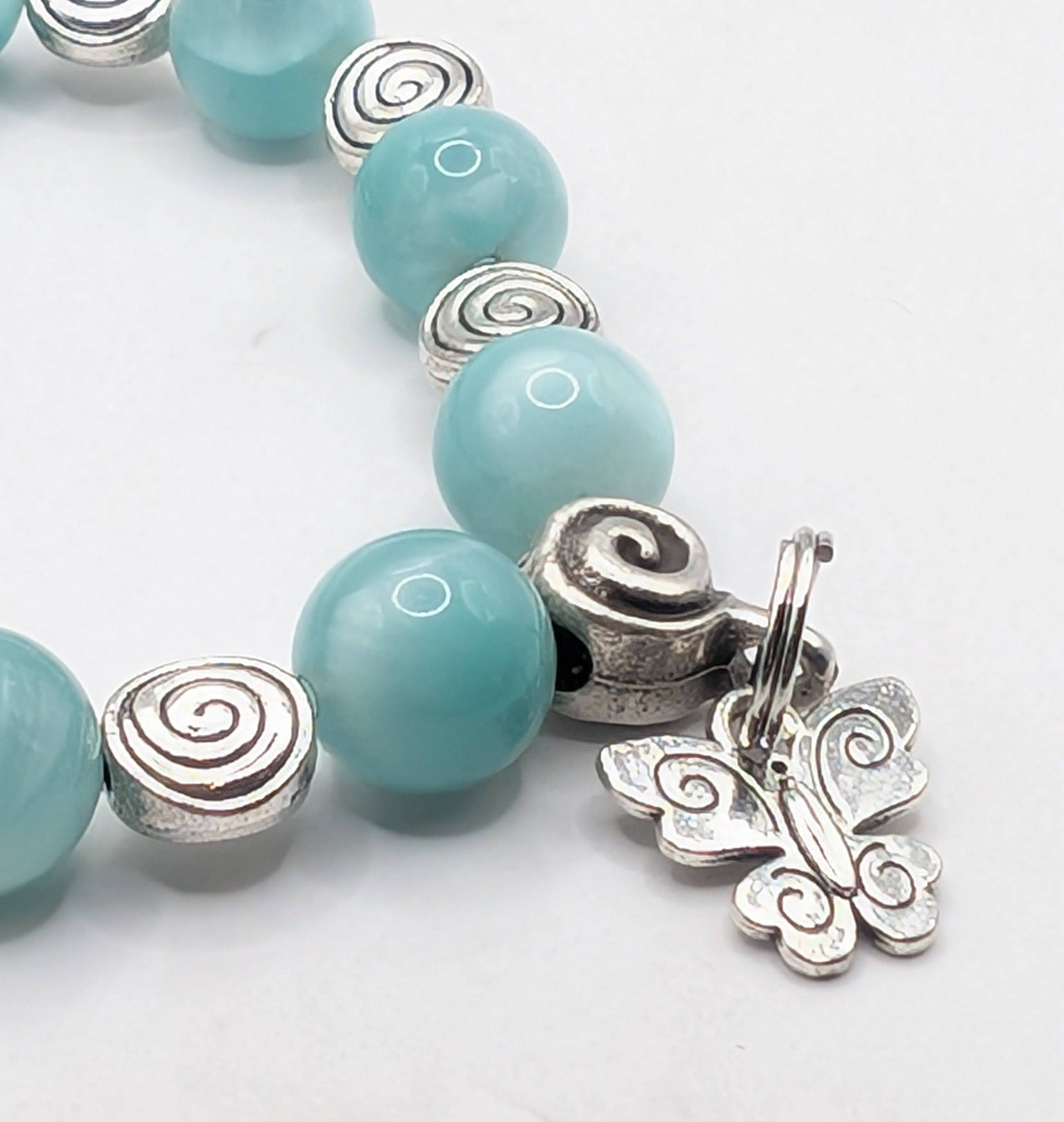 Green pectolite butterfly charm stretch bracelet detail, natural gemstone jewelry