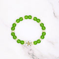 Handmade peridot green beach glass and Czech lemon ice stretch bracelet with flower accent