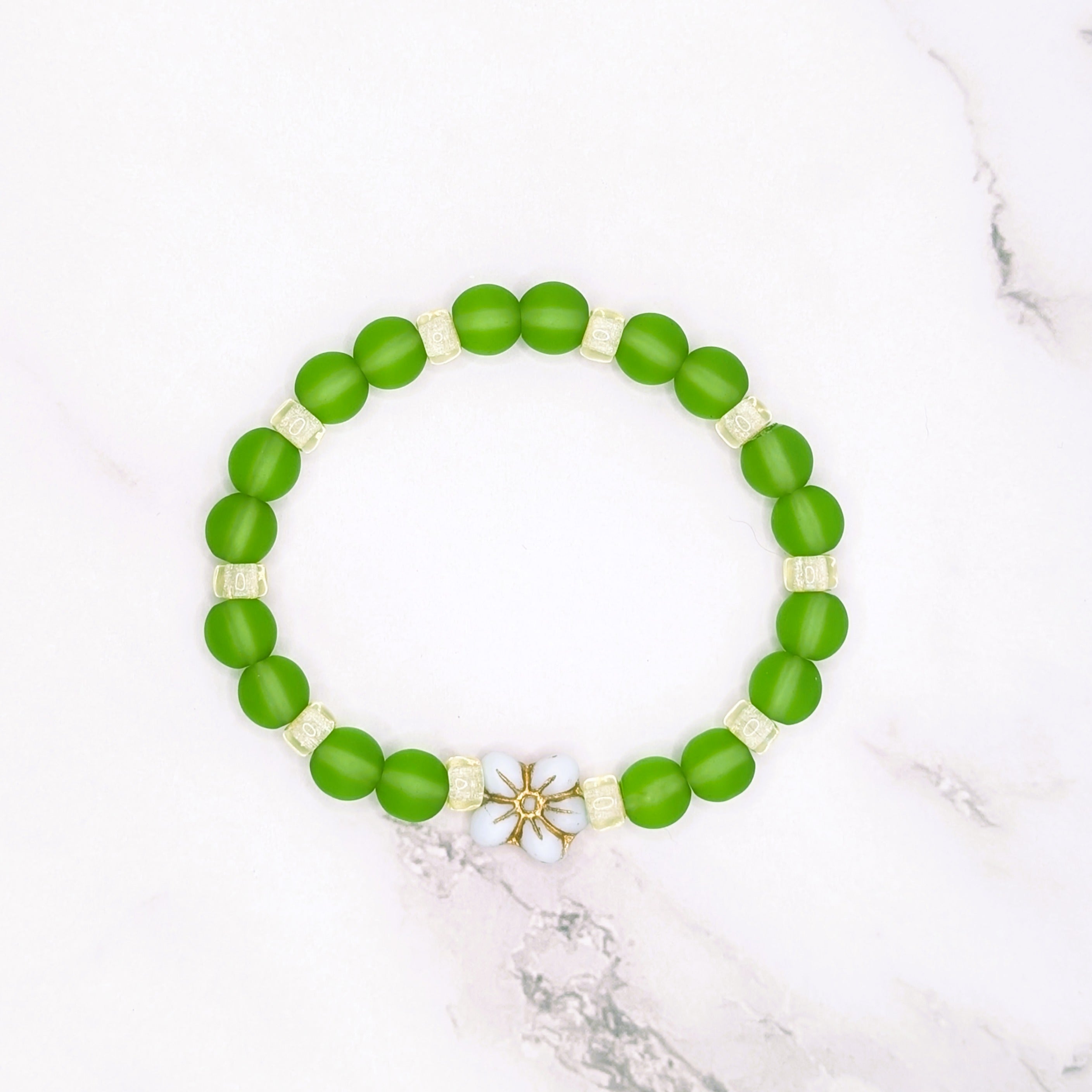 Handmade peridot green beach glass and Czech lemon ice stretch bracelet with flower accent