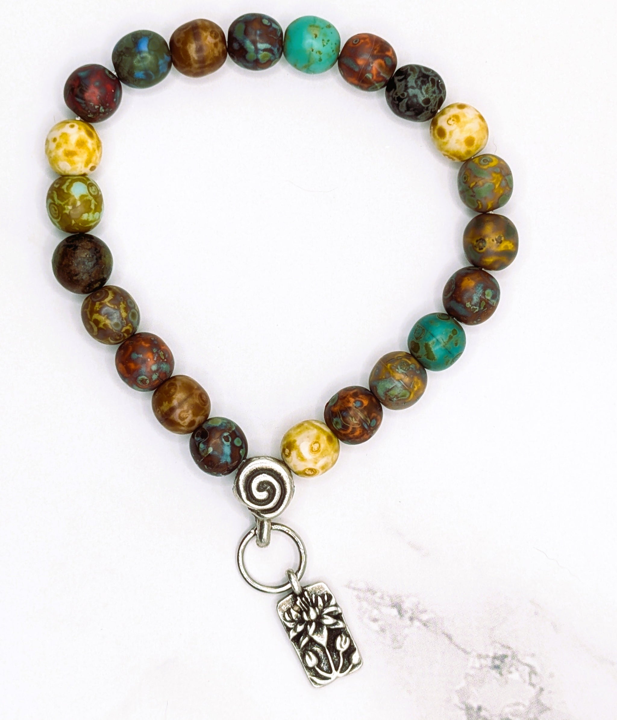 Handmade stretch bracelet with Czech glass Picasso beads and lotus charm