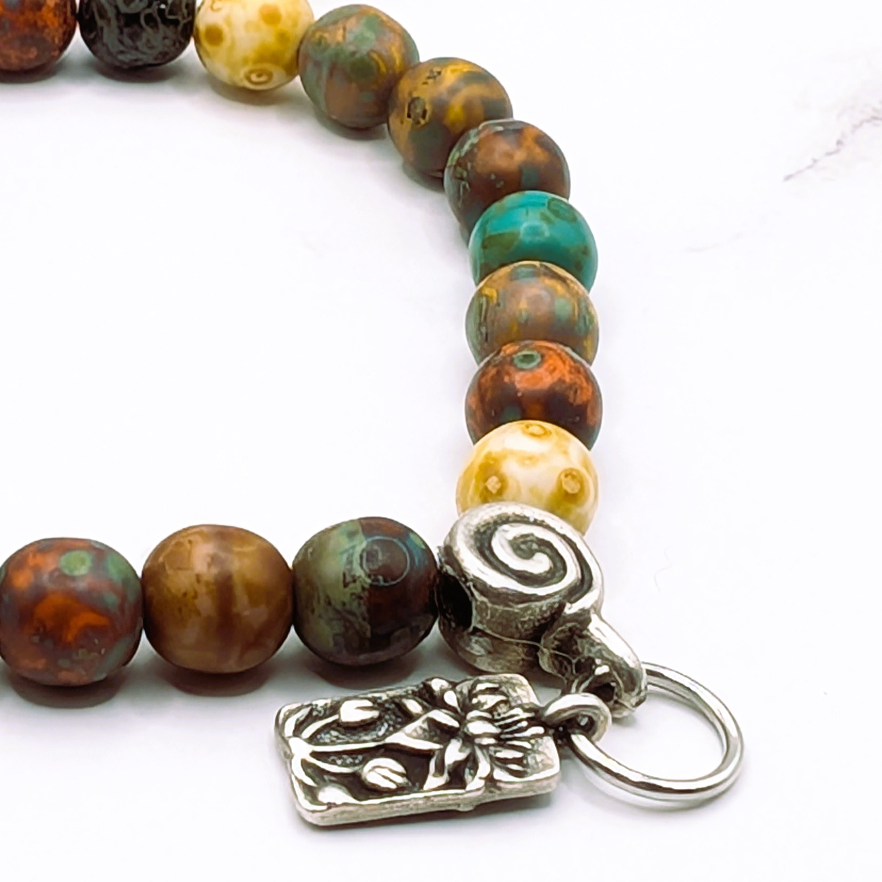 Czech glass Picasso bead lotus charm stretch bracelet detail, artisan jewelry