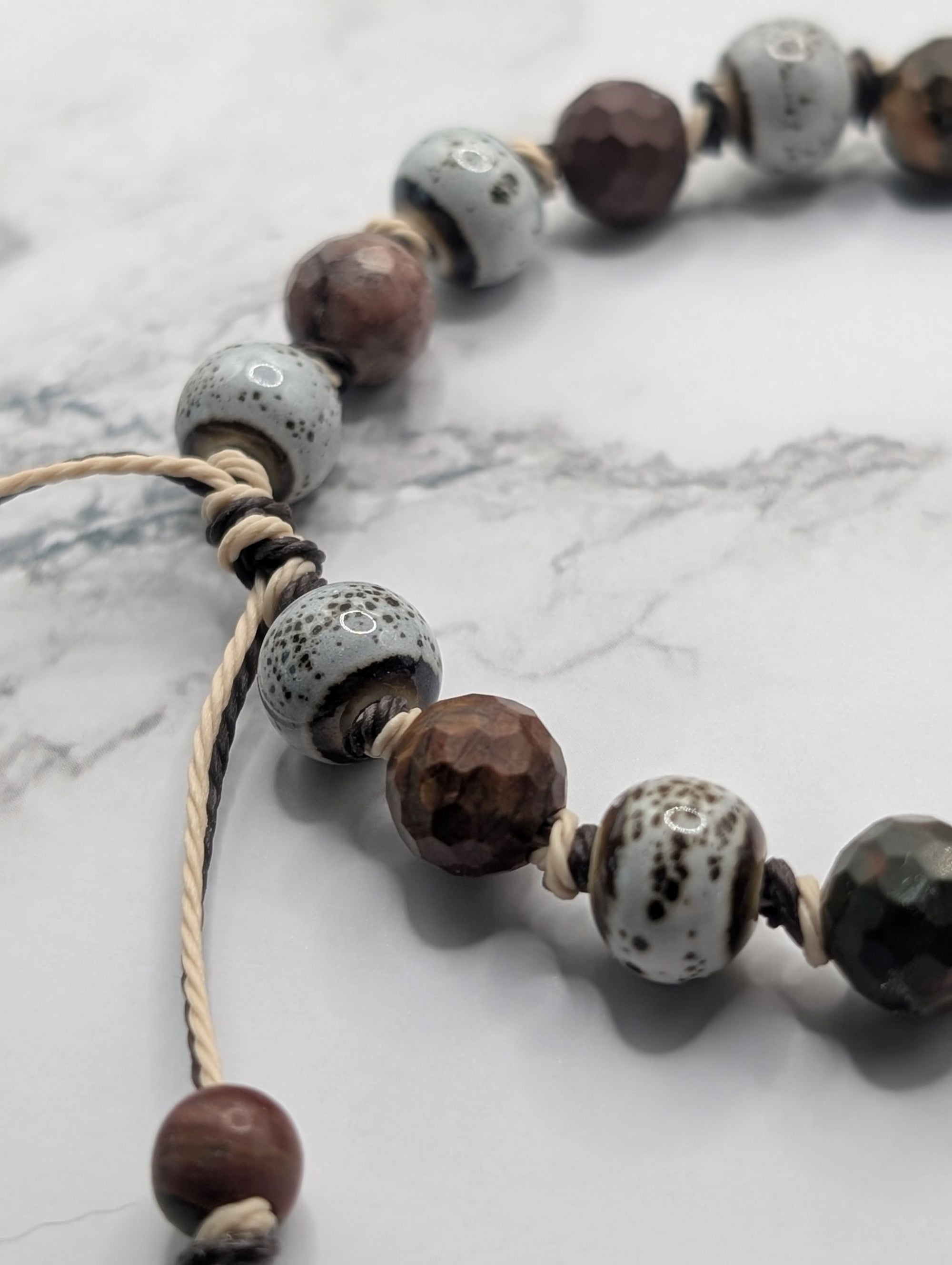 Birch speckled porcelain red jasper knotted bracelet detail, artisan gemstone jewelry