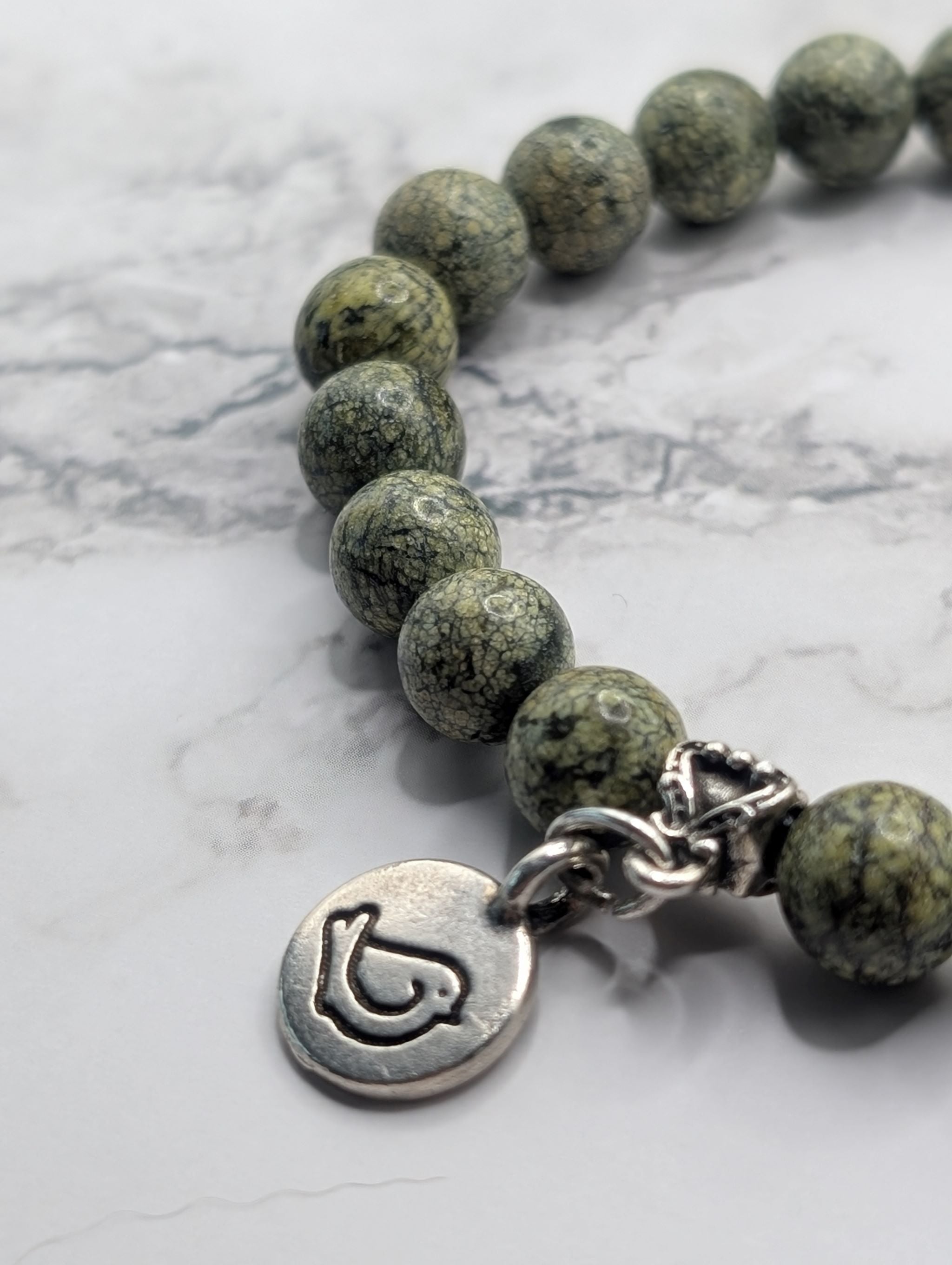Russian serpentine bird charm stretch bracelet detail, natural gemstone jewelry