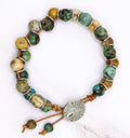 Handmade African turquoise and jasper leather bracelet with sand dollar clasp
