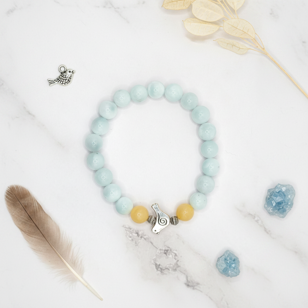 Angelite Honey Stone Bird Flat Lay