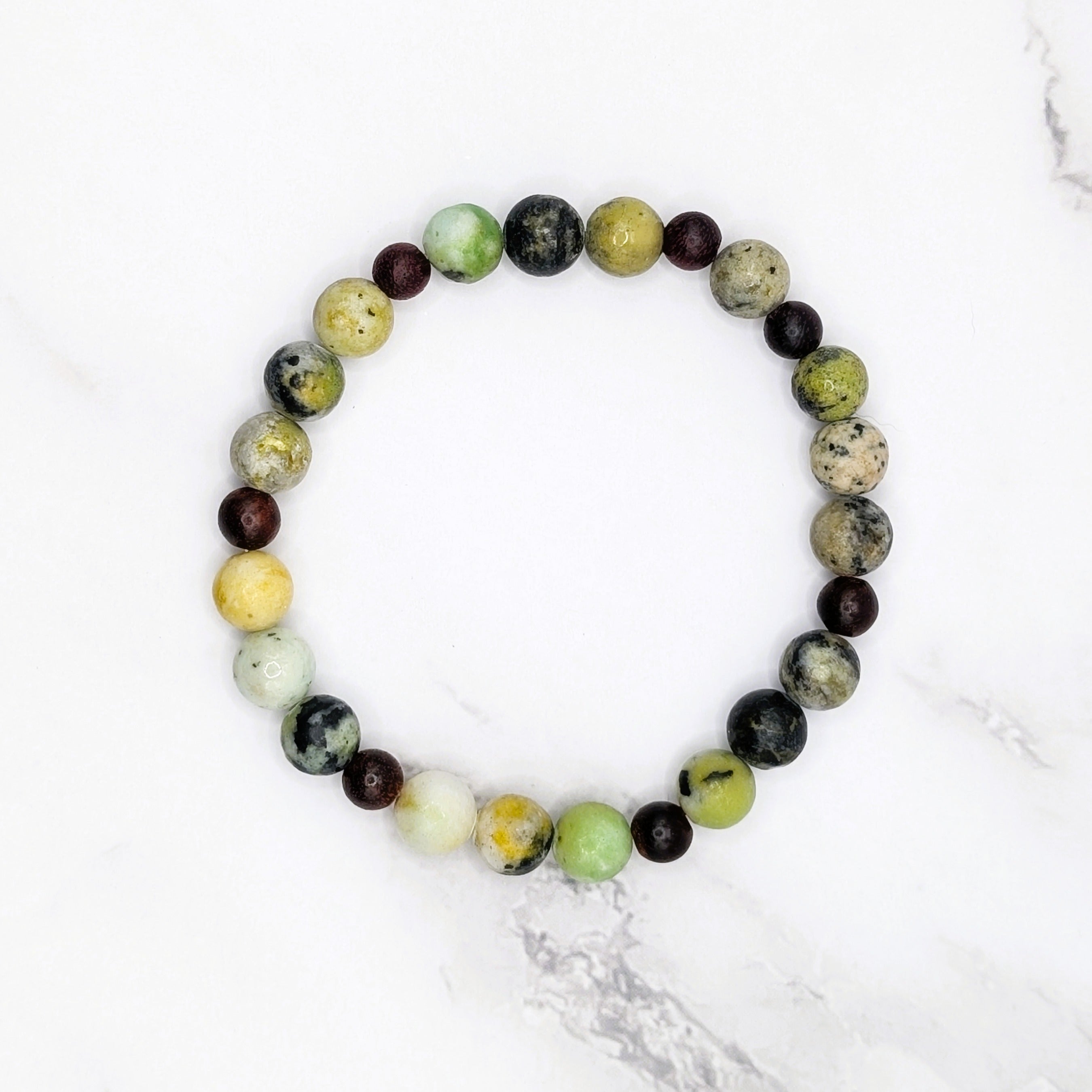 Handmade China chrysoprase stretch bracelet with wood accent beads, flat lay