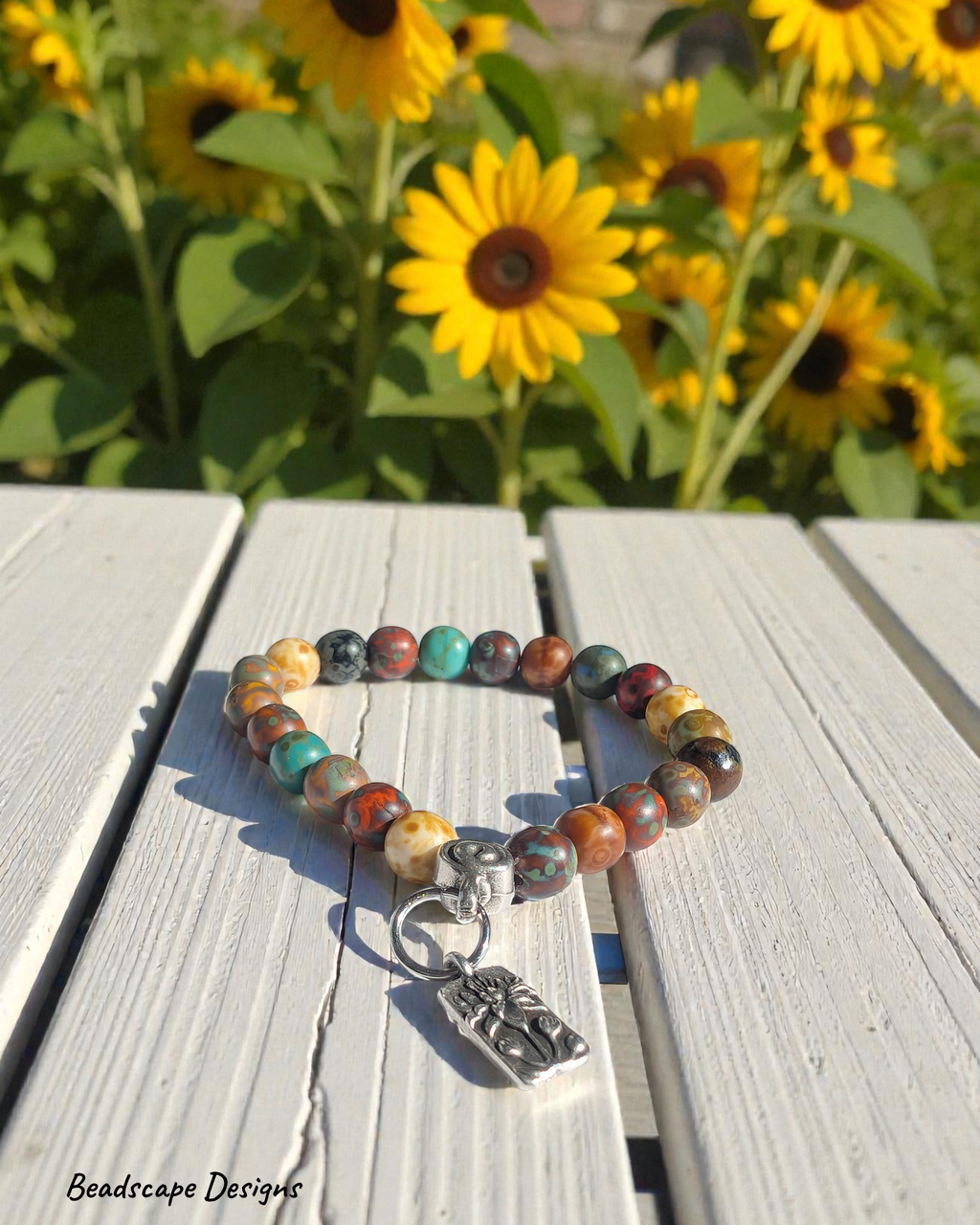 Stretch Bracelet with Czech Glass Picasso Beads and a Lotus Charm